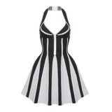 A black and white knit halter neck fit and flare dress with a striped pattern, laid flat.