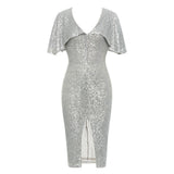 silver sequined dress with a v-neck and slit