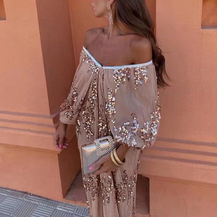 Close-up of a woman in a beige off-the-shoulder maxi dress with sequins, looking to the side.