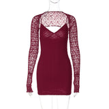 A burgundy lace mini dress with long sleeves on a mannequin