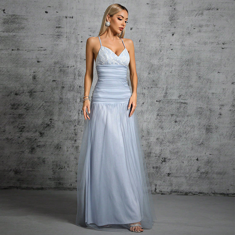 full body shot of a woman wearing a light blue gown
