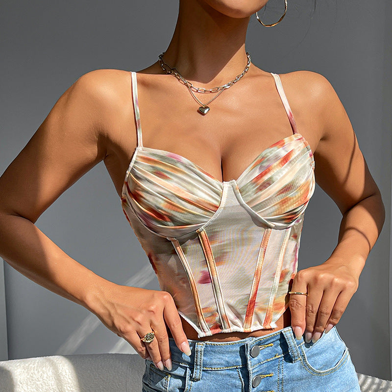 Close-up of a woman in a tie-dye corset top, showing the neckline and boning details.