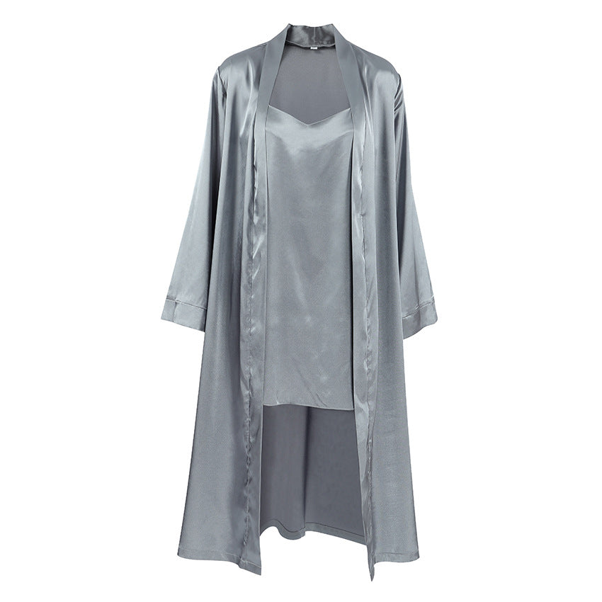 A grey satin robe and cami dress laid out flat.