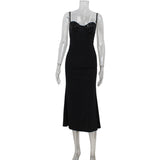 A black sequined midi dress on a mannequin.