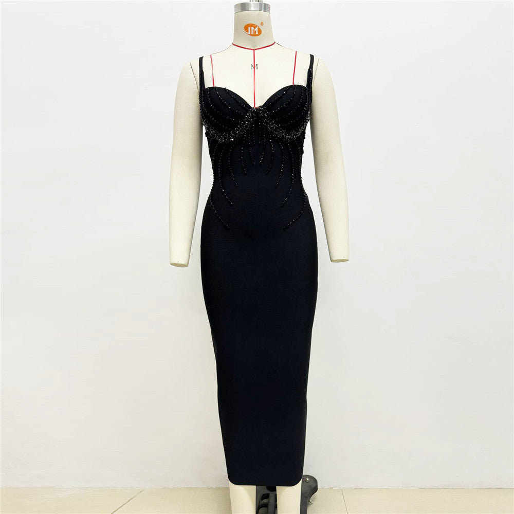 black midi dress with beaded embellishment and spaghetti straps on a mannequin