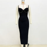 black midi dress with beaded embellishment and spaghetti straps on a mannequin