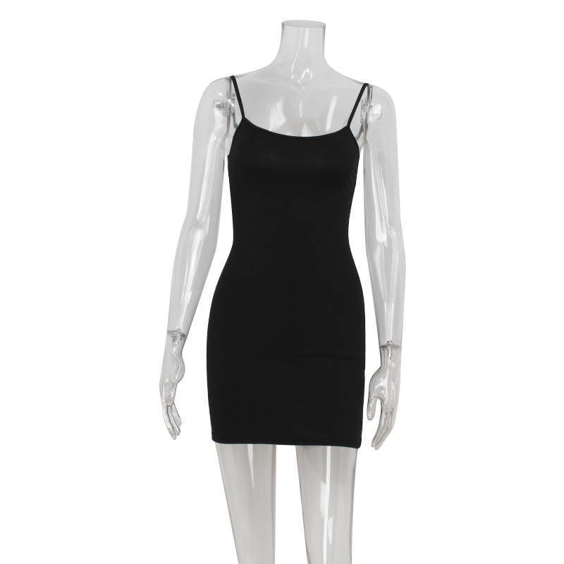 Mannequin displaying a black spaghetti strap slip dress.