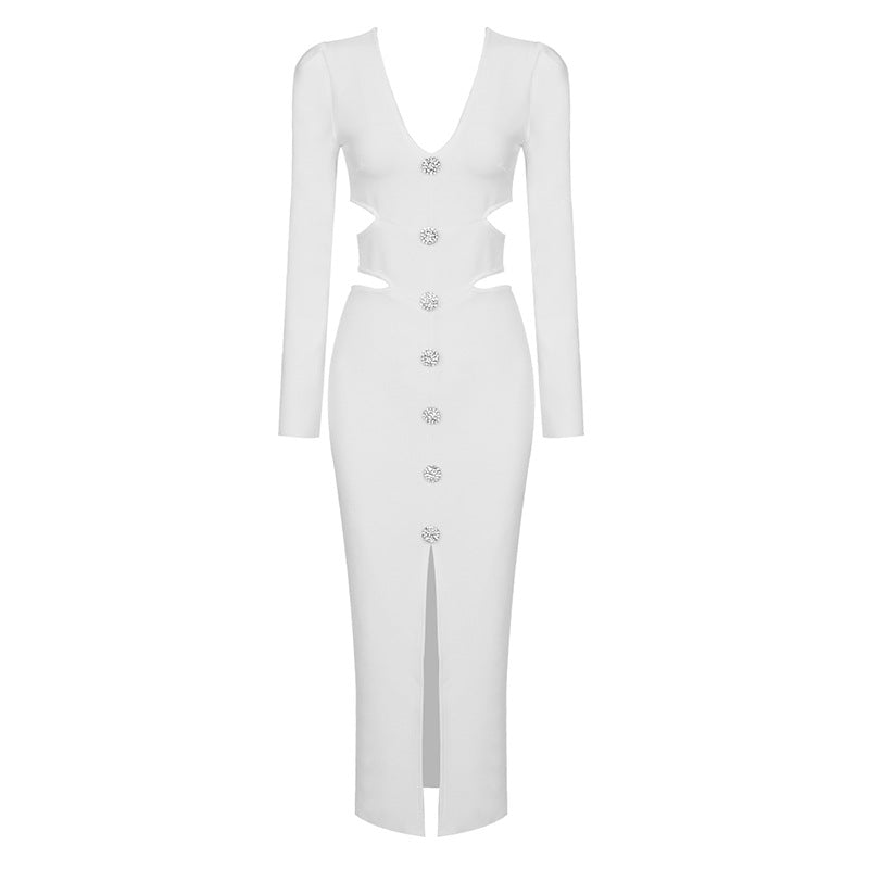A white midi dress with long sleeves, a v-neck, cut-outs, button details, and a high slit, displayed on a white background.