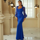 full length shot of a woman posing in a royal blue evening dress