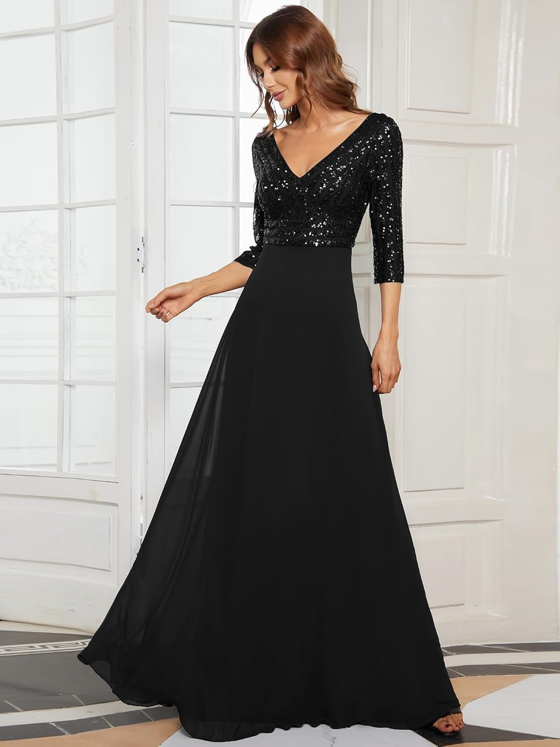 woman in a black sequined dress