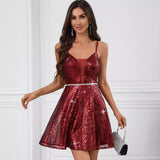 woman in red sequin dress with v-neck and thin straps