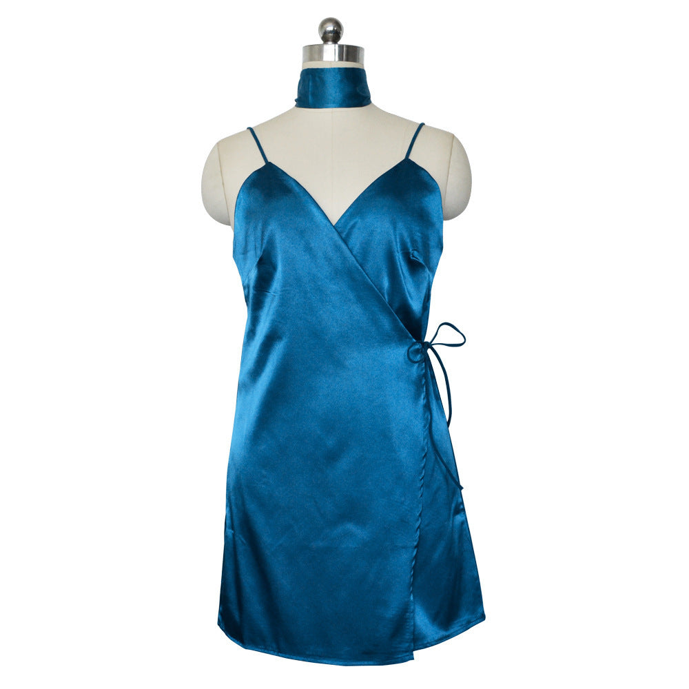 Teal satin wrap dress with spaghetti straps and a tie waist on a mannequin