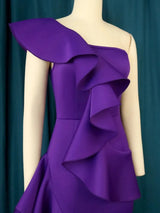 Purple one-shoulder dress with ruffles on a mannequin