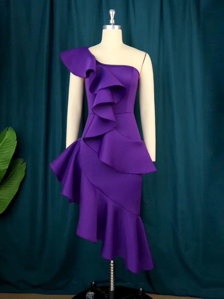 Purple one-shoulder dress with ruffles and asymmetrical hem on a mannequin