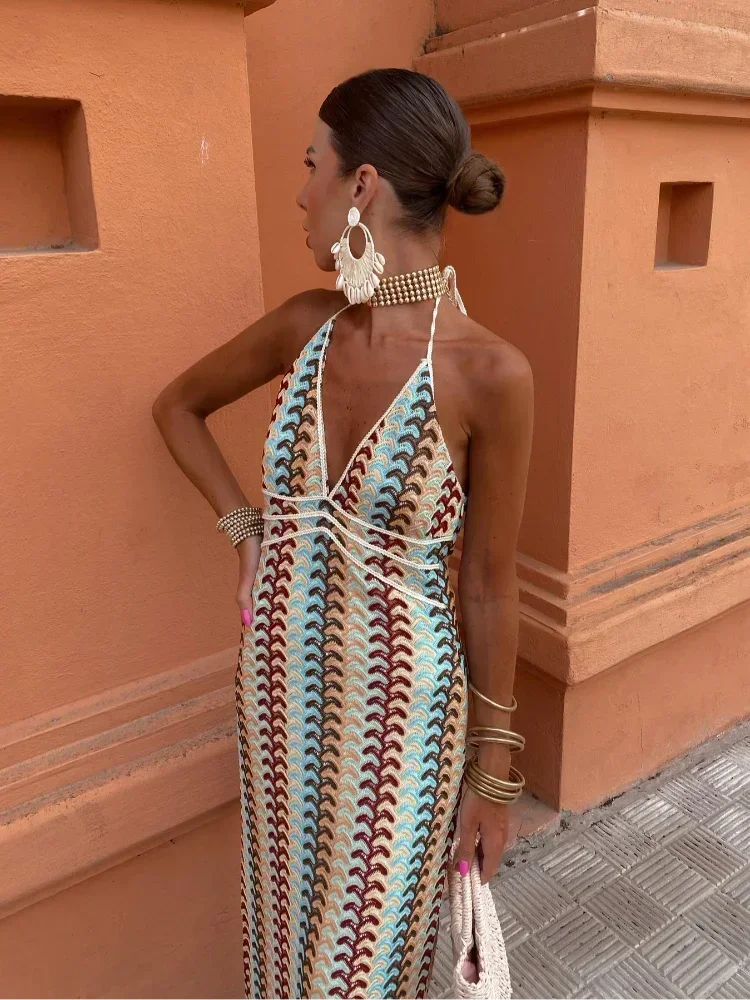 Close-up of the woman's upper body, showing the details of the dress neckline and jewelry.