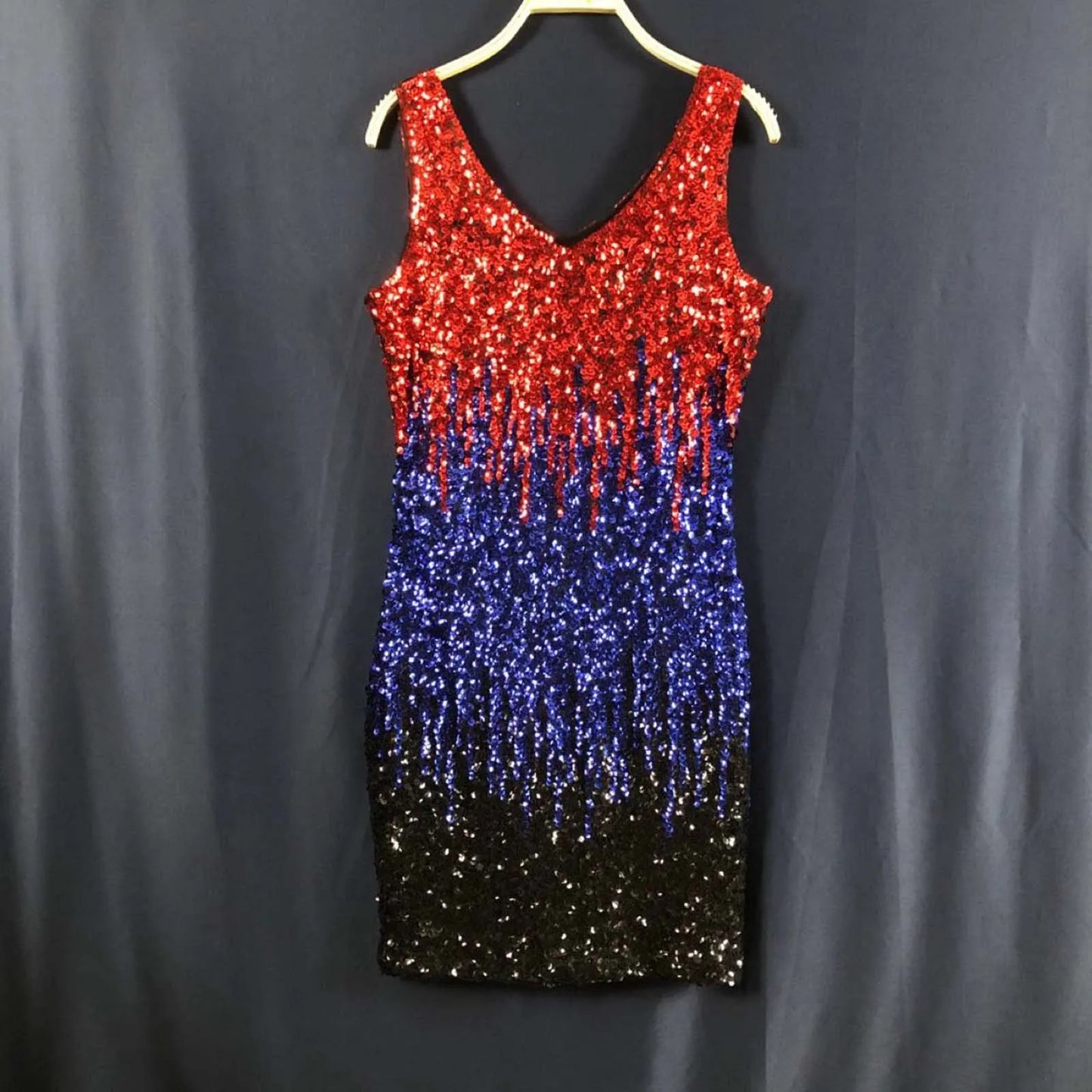 A sleeveless V-neck sequined dress with a red, blue, and black ombre effect.