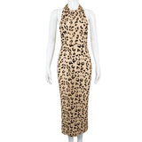 A beige and black leopard print halter dress on a mannequin.