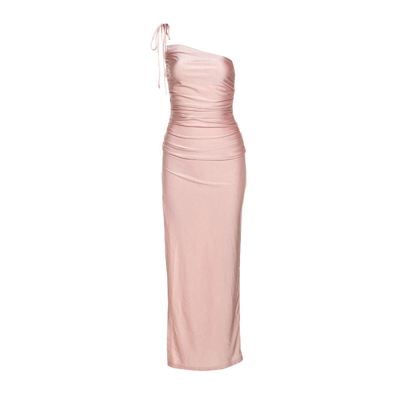 Full-length view of a pink ruched one-shoulder dress on a mannequin