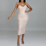 woman in champagne sequined midi dress with spaghetti straps