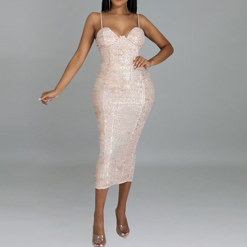 woman in champagne sequined midi dress with spaghetti straps