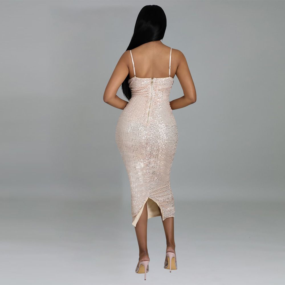woman in champagne sequined midi dress from the back showing zipper