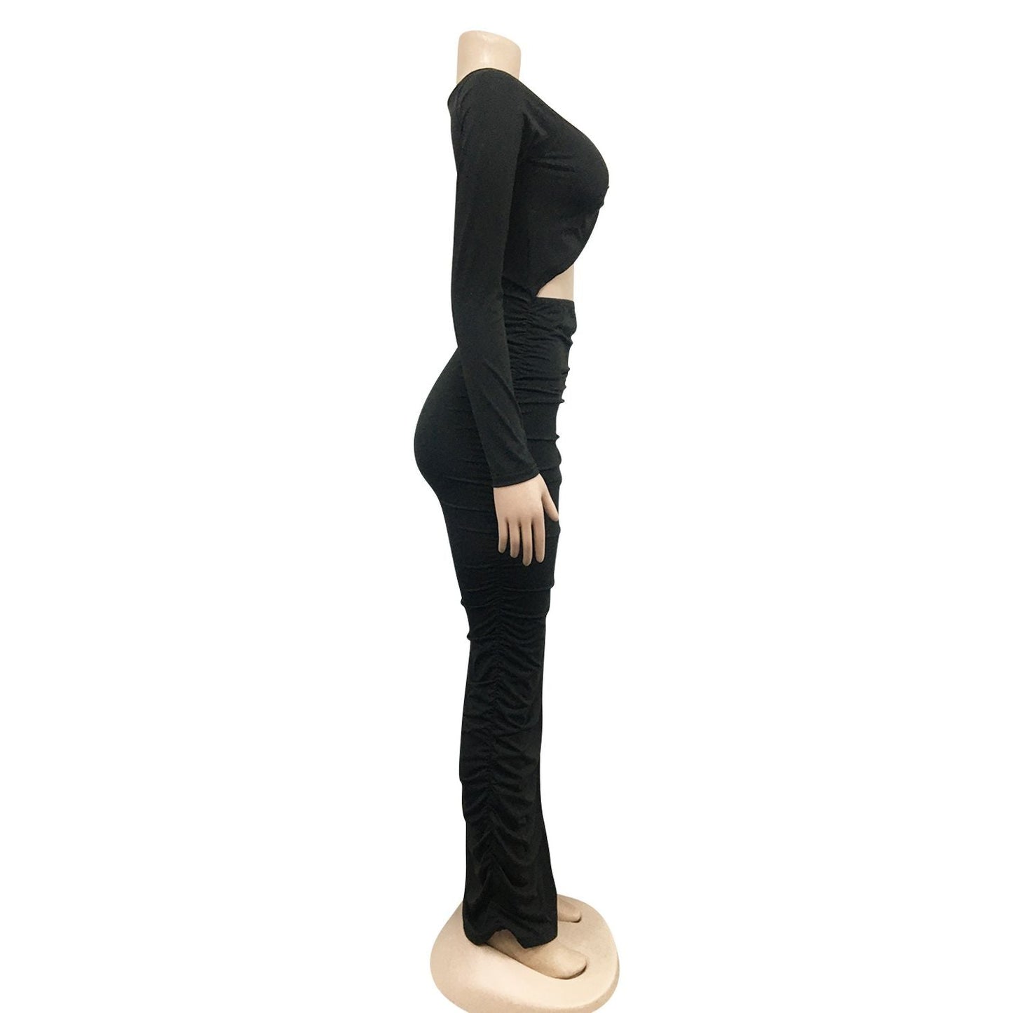 side view of a black ruched maxi dress on a mannequin