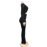 side view of a black ruched maxi dress on a mannequin