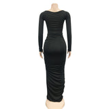 back view of a black ruched maxi dress on a mannequin