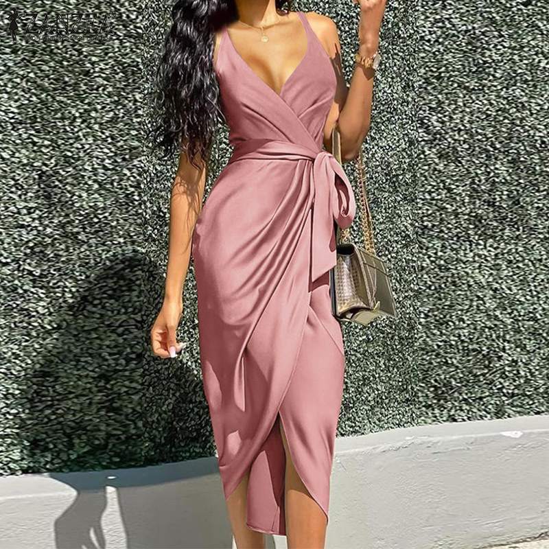 woman wearing a pink satin wrap dress with a tie waist