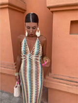 Medium shot of the woman, focusing on the dress's pattern and the accessories she's wearing.