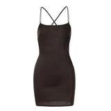 A brown satin mini dress with spaghetti straps and a crisscross back.