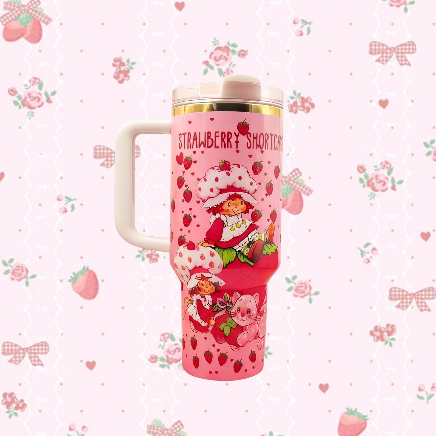 Stanley 40oz Sweet Berry Daydream Tumbler with pink Strawberry Shortcake artwork and ergonomic handle - View 1 | Clistos