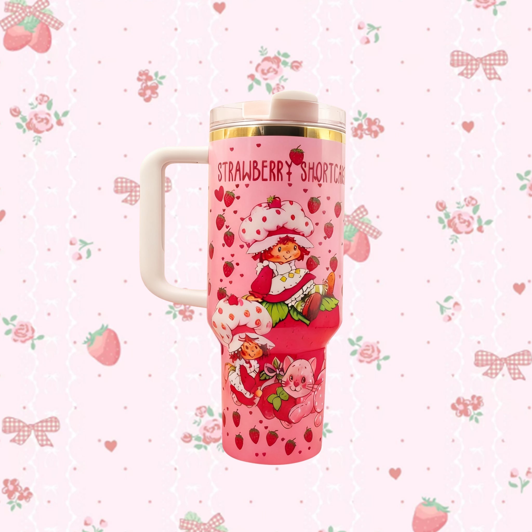 Stanley 40oz Sweet Berry Daydream Tumbler with pink Strawberry Shortcake artwork and ergonomic handle - View 1 | Clistos