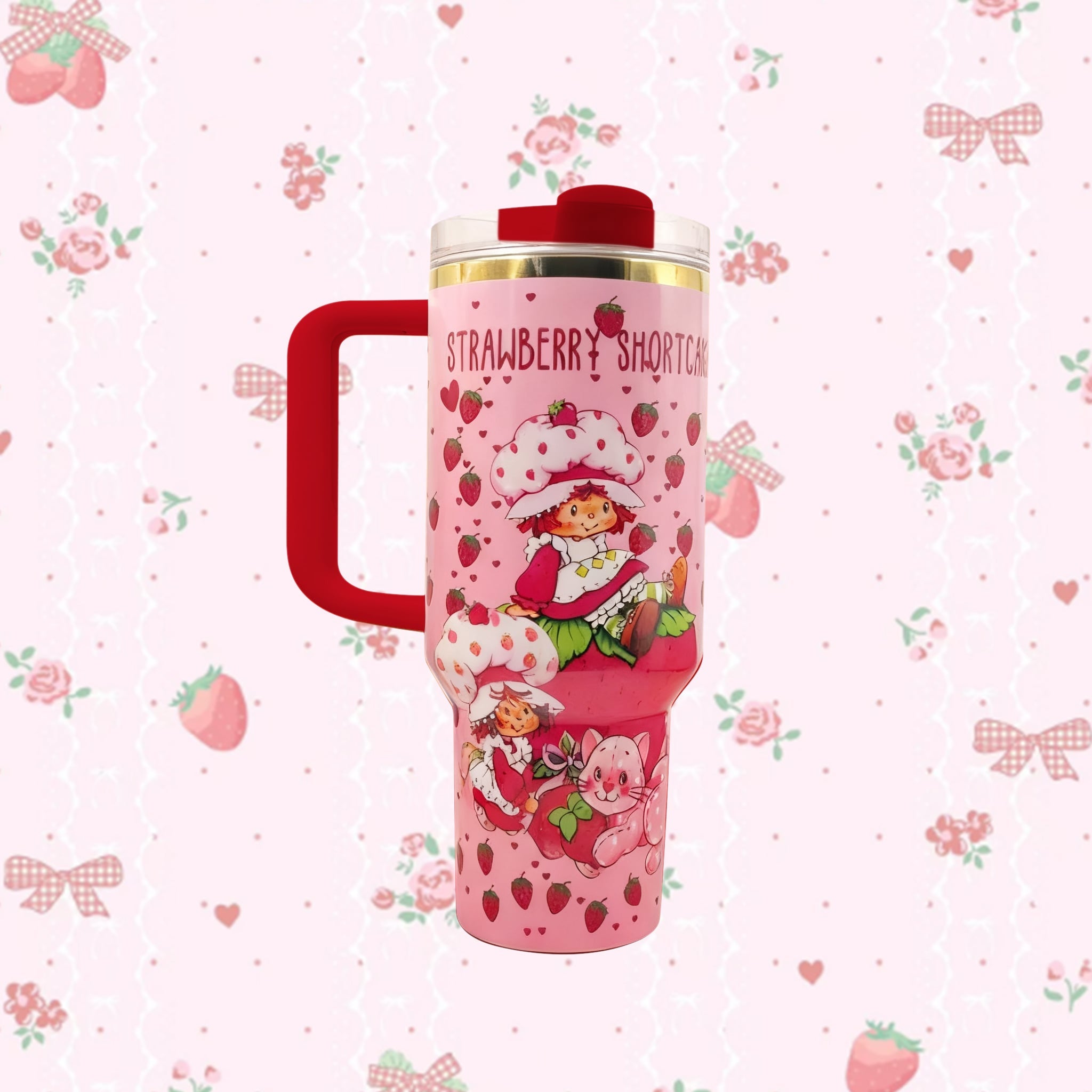 Stanley 40oz Sweet Berry Daydream Tumbler with pink Strawberry Shortcake artwork and ergonomic handle - View 2 | Clistos