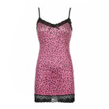 Pink leopard print slip dress with black lace trim on a white background, front view.