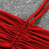 close-up of red ruched halter neck dress detail
