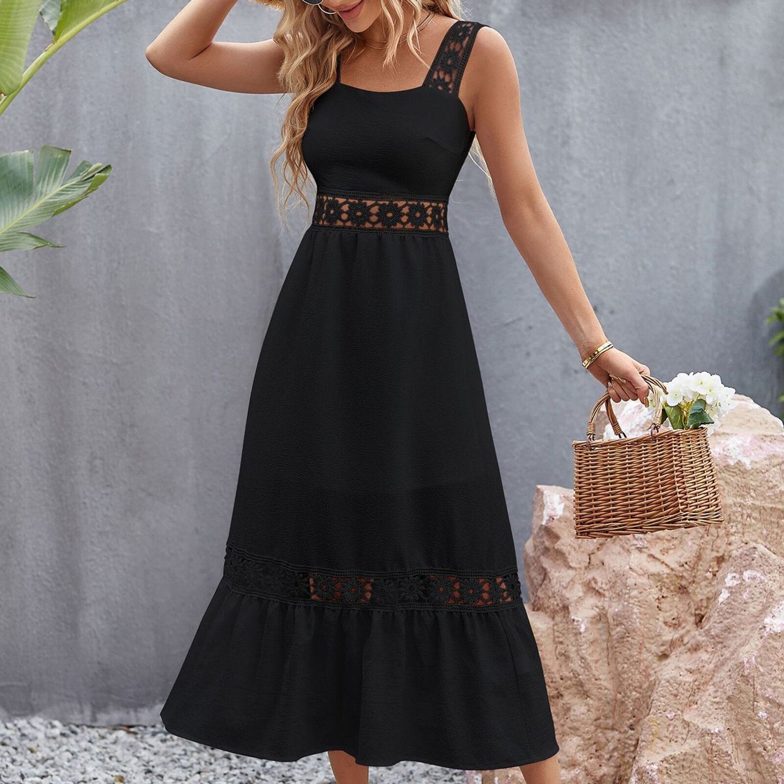 woman in black dress holding a basket of flowers