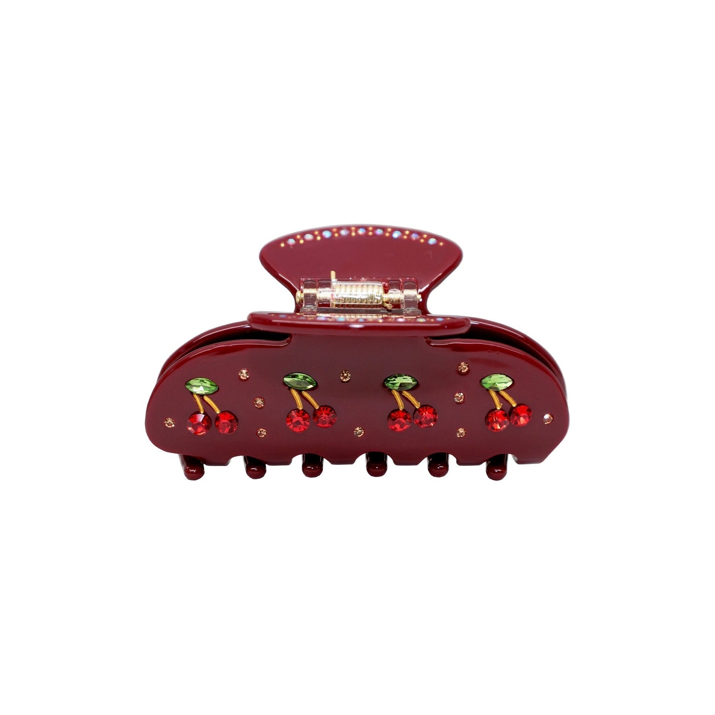 A maroon claw clip with cherry and rhinestone embellishments.