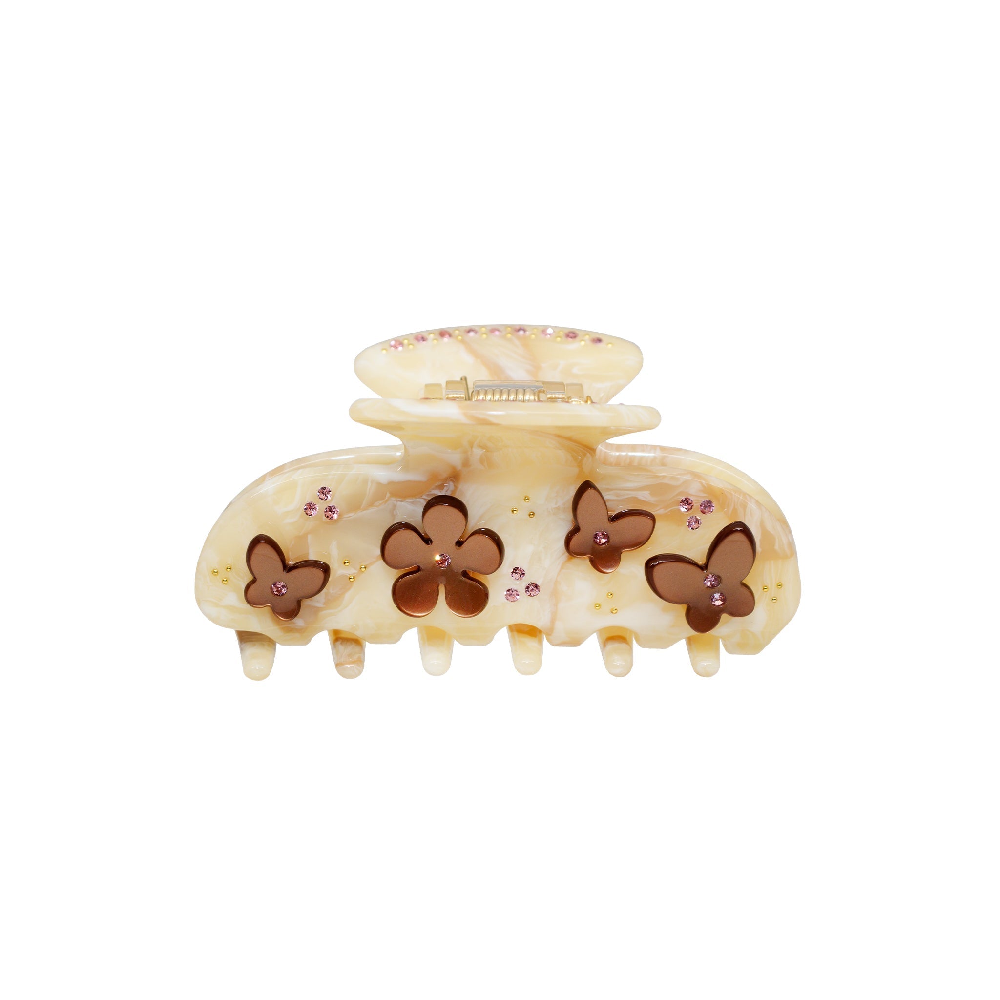 A beige and brown marbled claw clip with flower and butterfly embellishments and pink rhinestones