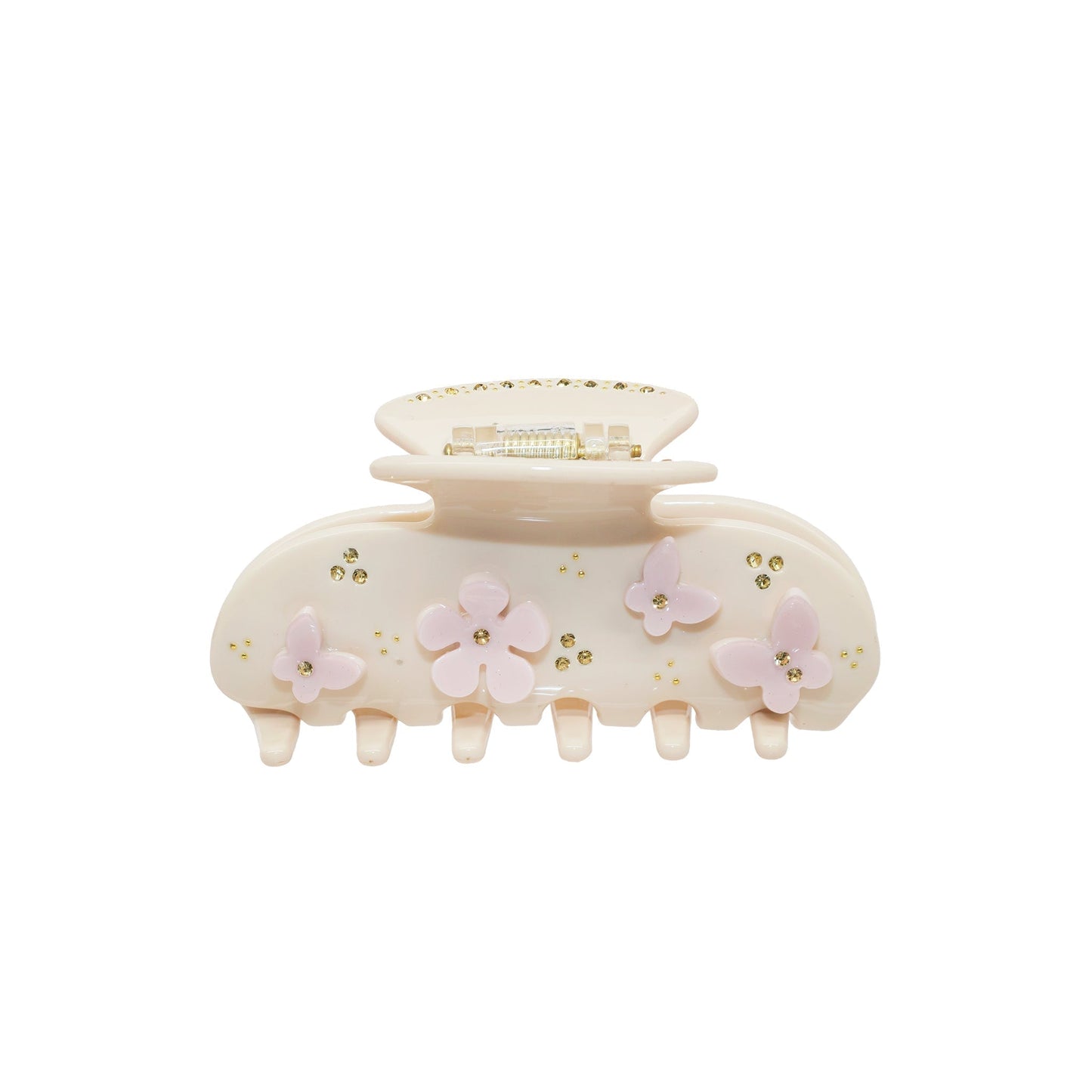 A beige claw clip with pink butterfly and flower embellishments and gold rhinestones