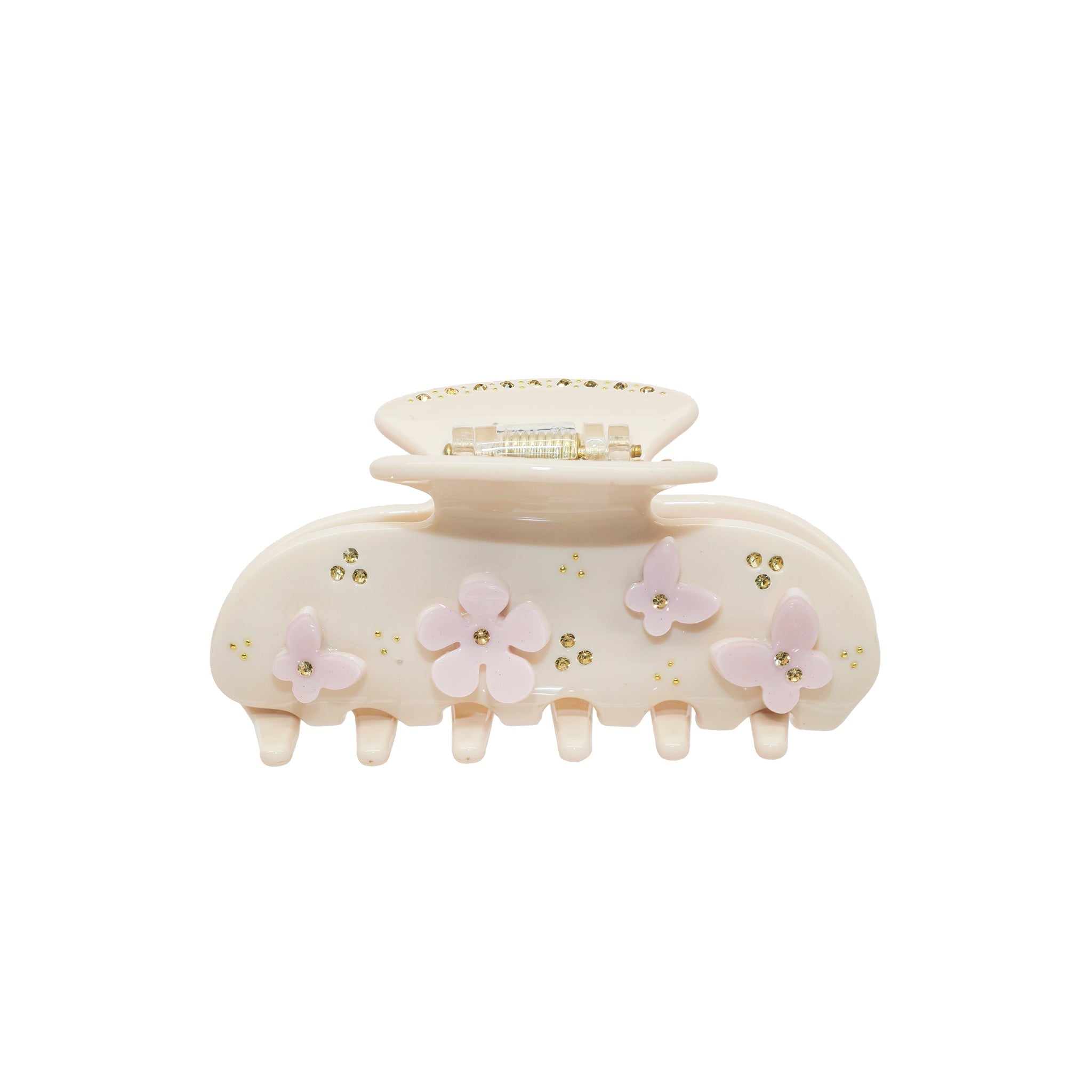 A beige claw clip with pink butterfly and flower embellishments and gold rhinestones