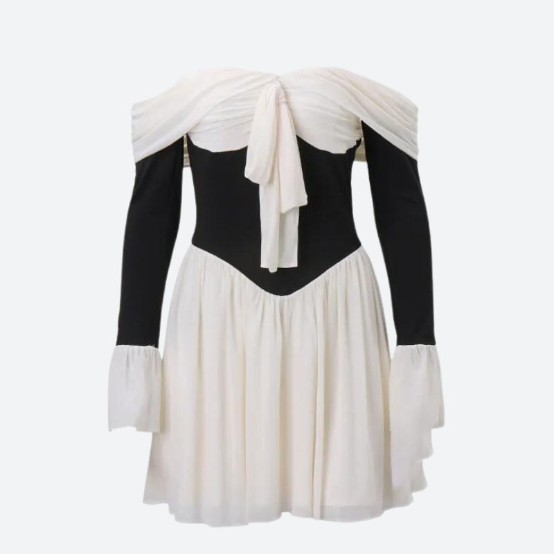 black and white off-the-shoulder dress with a bow detail and flared sleeves on a white background