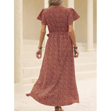 back view of woman in red floral print wrap dress