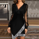 woman wearing a black sparkly long-sleeved dress with an asymmetrical sequined hem