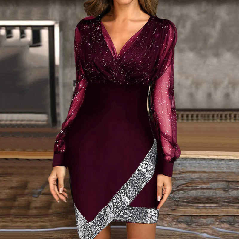 woman wearing a burgundy sparkly long-sleeved dress with an asymmetrical sequined hem