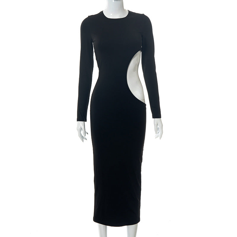 A mannequin displays a black long-sleeved midi dress with a prominent cut-out on the side.