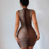 Back view of a woman in a brown and white striped sleeveless bodycon dress