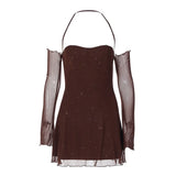 A brown, sparkly mini dress with sheer, off-the-shoulder sleeves and a halter neckline is displayed against a white background.
