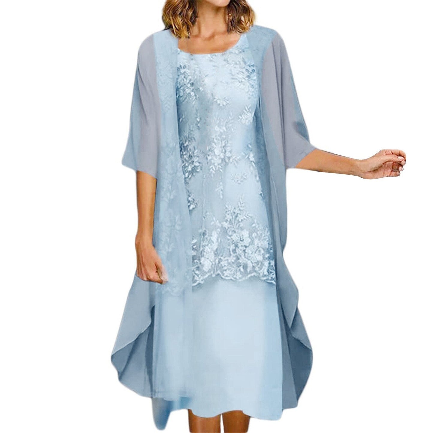 A woman wearing a light blue floral lace dress with a sheer overlay.