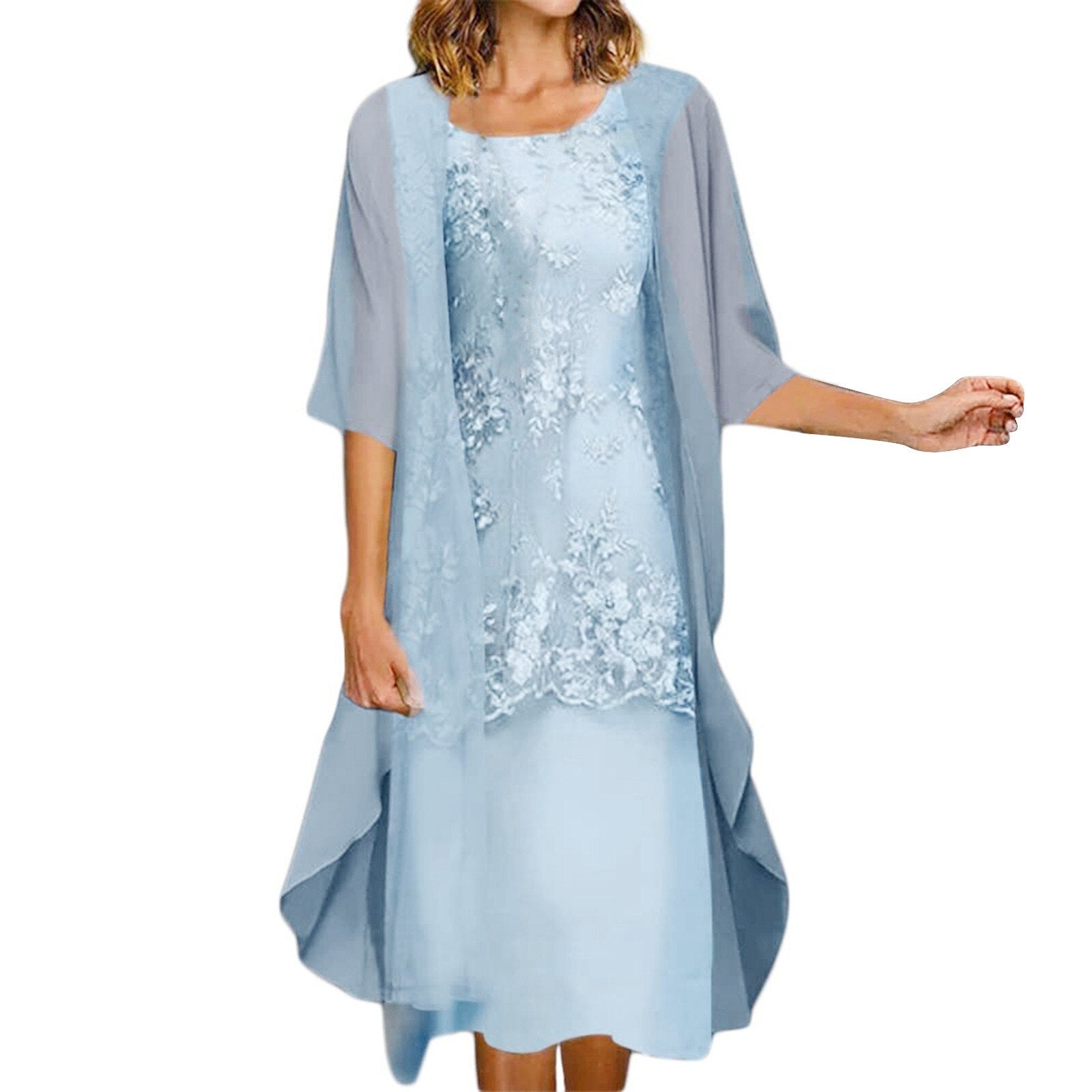 A woman wearing a light blue floral lace dress with a sheer overlay.